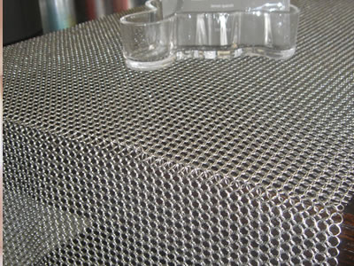 Detail about chainmail curtain used for table.