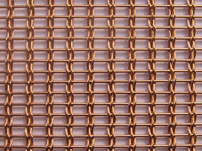 An enlarge view of woven wire drapery in copper color, and it is woven by three strand wire rope and copper rods.