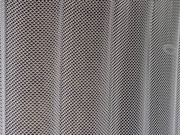 A piece of metal coil curtain with 15% fullness effectiveness.