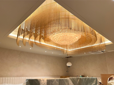 Yellow metal coil drapery staggered hanging in the hall