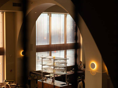 Metal coil drapery used for restaurant window decoration