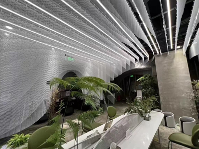 Metal coil drapery used as a special-shaped ceiling decoration & room divider